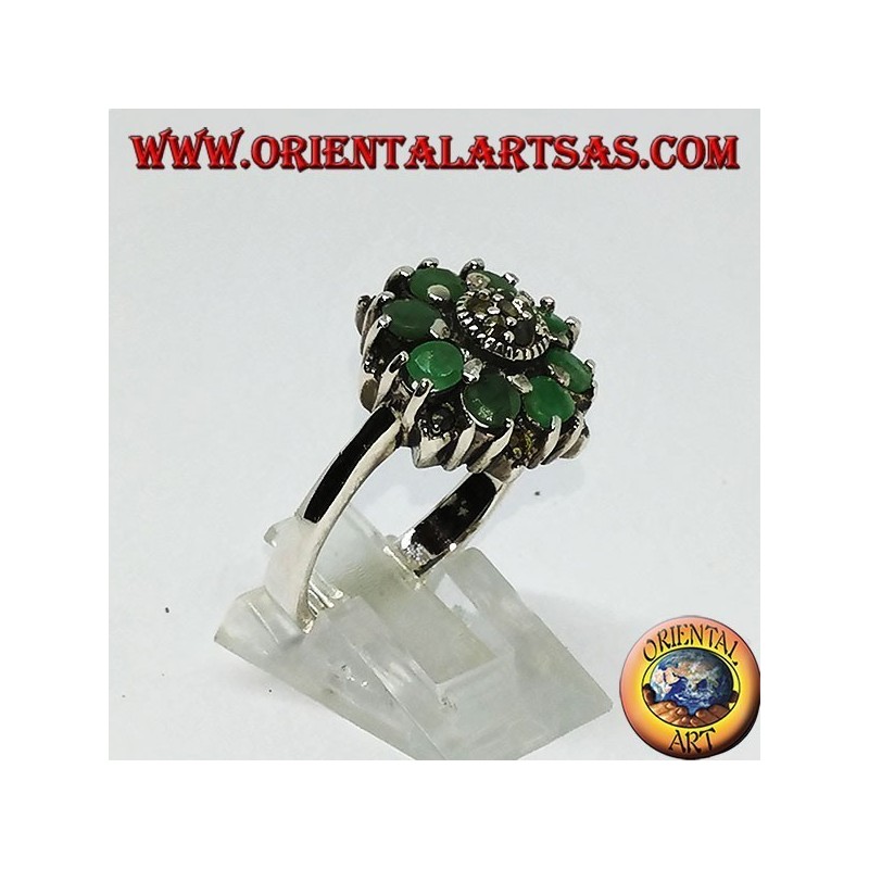 Silver ring in flower with 8 natural round emeralds surrounded by marcasites