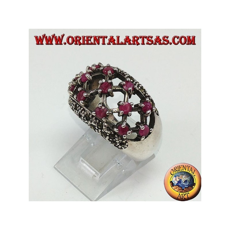 Silver ring with rounded perforated band with 13 round set rubies