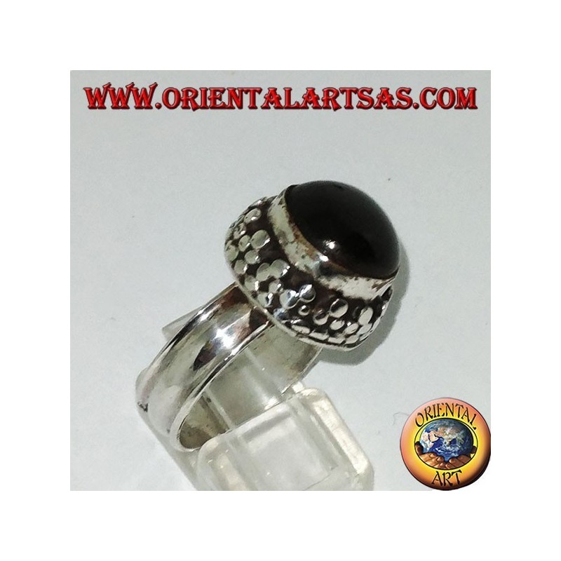 Silver ring on high edge with round Black Star set