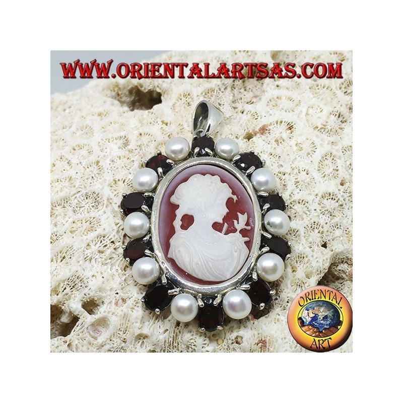 Silver pendant with cameo on mother of pearl surrounded by pearls and garnets