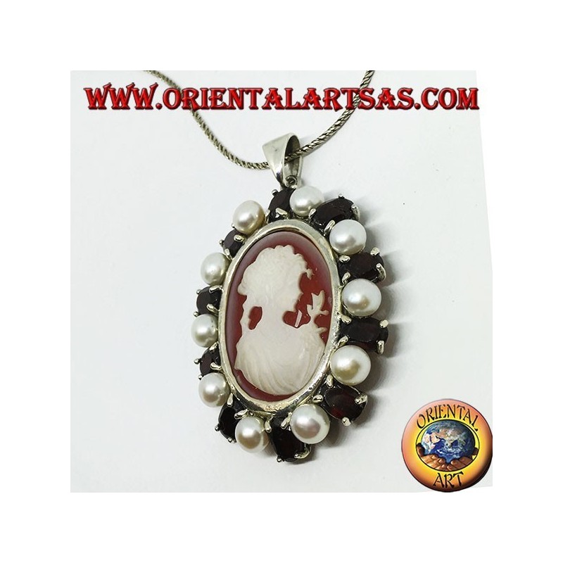 Silver pendant with cameo on mother of pearl surrounded by pearls and garnets