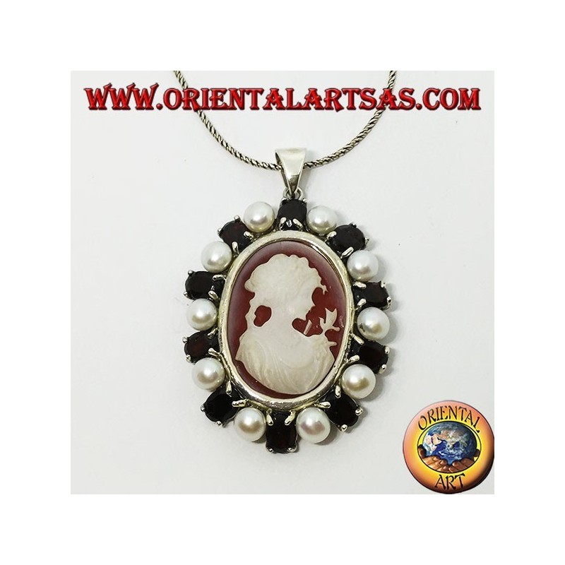 Silver pendant with cameo on mother of pearl surrounded by pearls and garnets