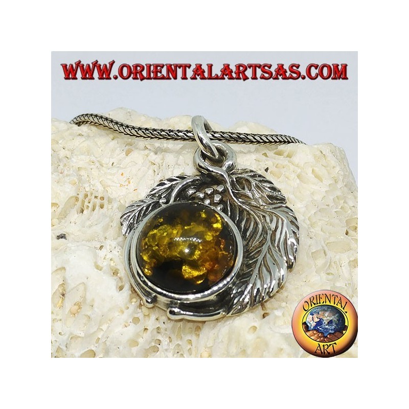 Silver pendant with a hemispherical amber between the leaves