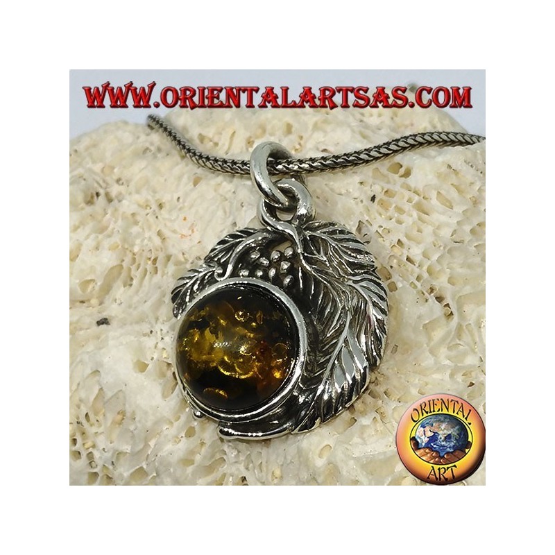 Silver pendant with a hemispherical amber between the leaves