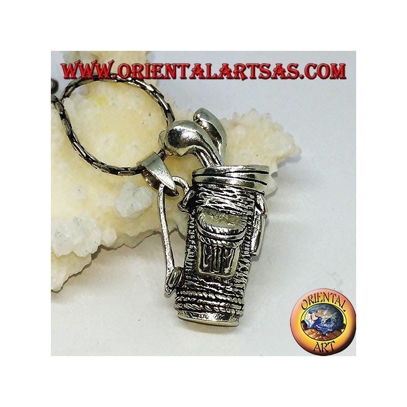 Silver pendant, golf bag with clubs
