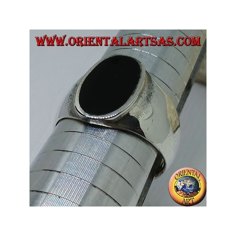 Silver ring with flat oval onyx flush with the edge