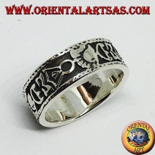 Silver band ring with Maori bas-relief designs