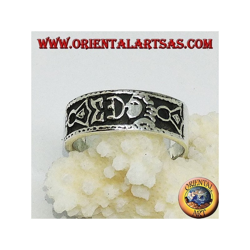 Silver band ring with Maori bas-relief designs