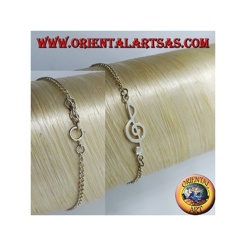 Pulsera de plata suave con una clave de sol en el centro.