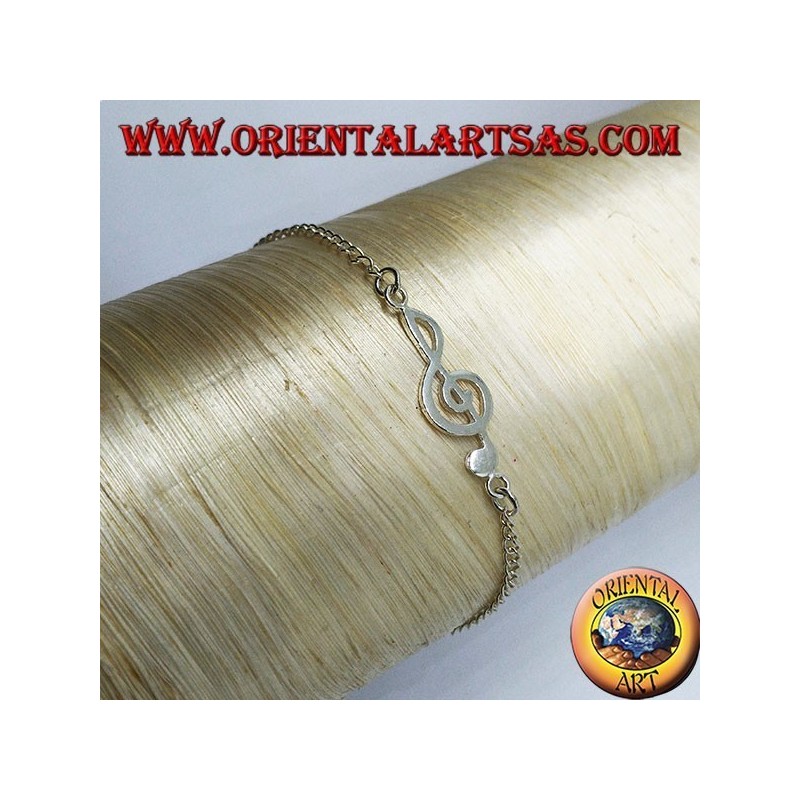 Pulsera de plata suave con una clave de sol en el centro.