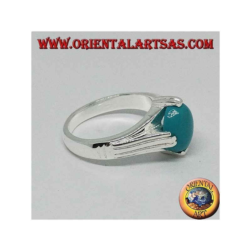 Anillo de plata con turquesa ovalada en cuatro puntos.