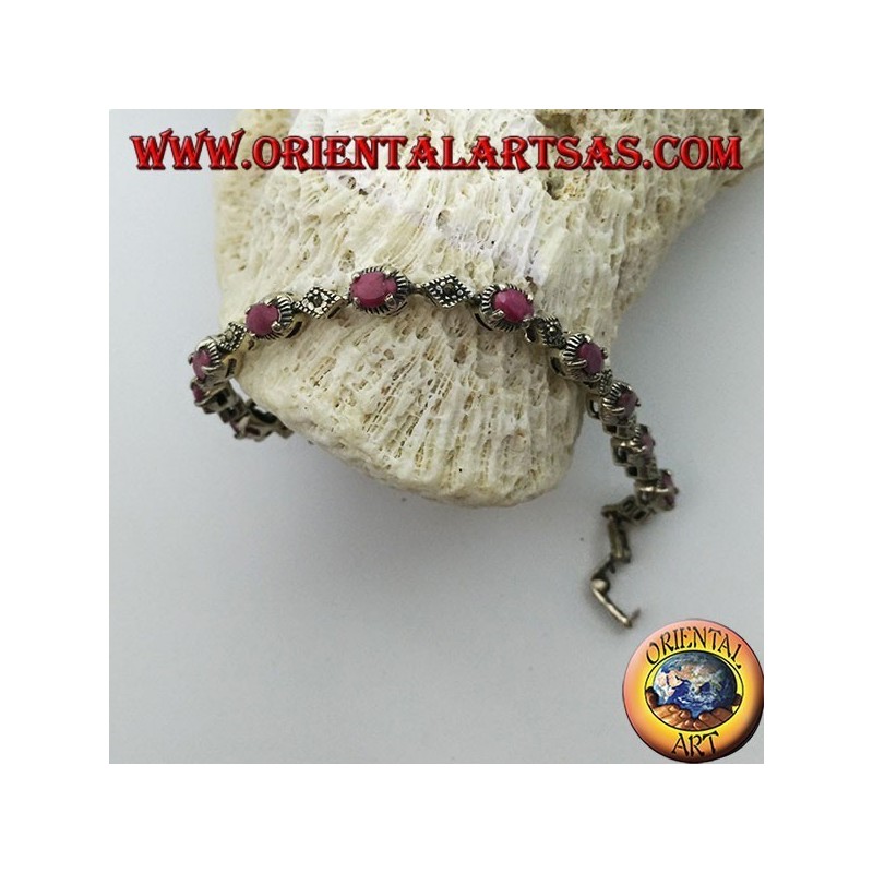 Bracciali in argento con 12 rubini ovali  incastonati da 4 griffe, e marcasite
