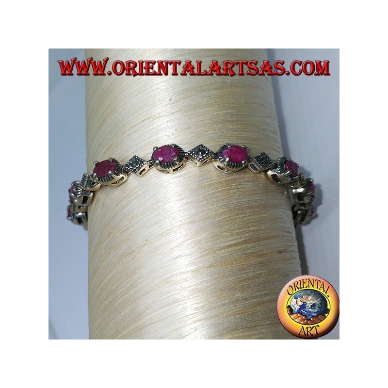 Pulseras de plata con 12 rubíes ovalados engastados con 4 mandíbulas y marcasita.