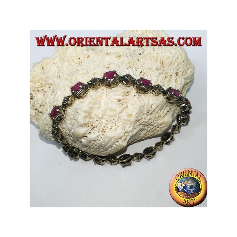 Pulseras de plata con 12 rubíes ovalados engastados con 4 mandíbulas y marcasita.