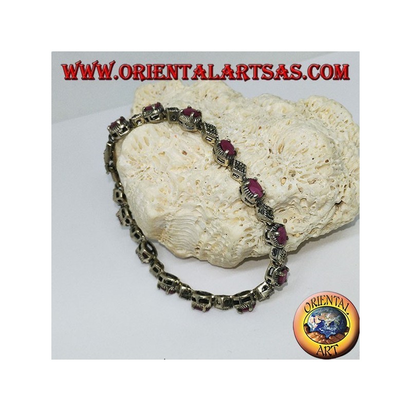 Bracciali in argento con 12 rubini ovali  incastonati da 4 griffe, e marcasite
