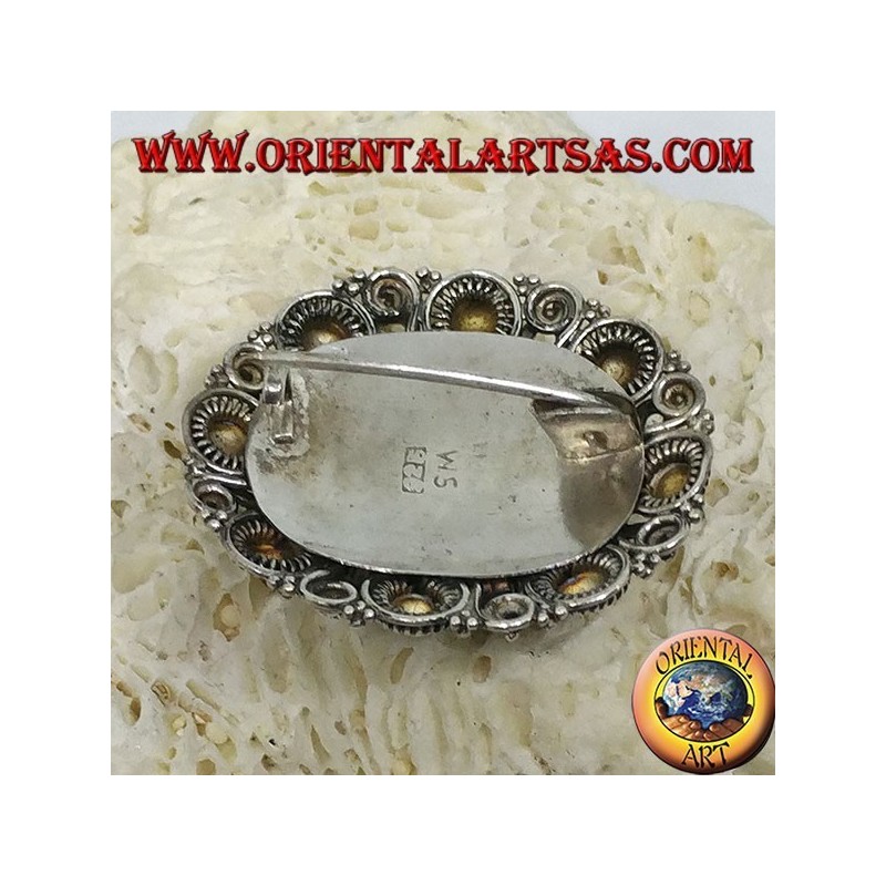 Broche de plata hecho a mano con ónix oval