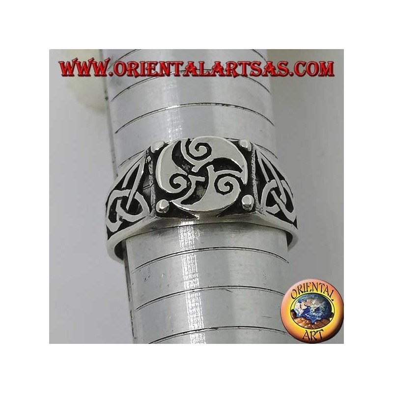 Silver ring with triskele three spirals and Tyrone knots on the sides