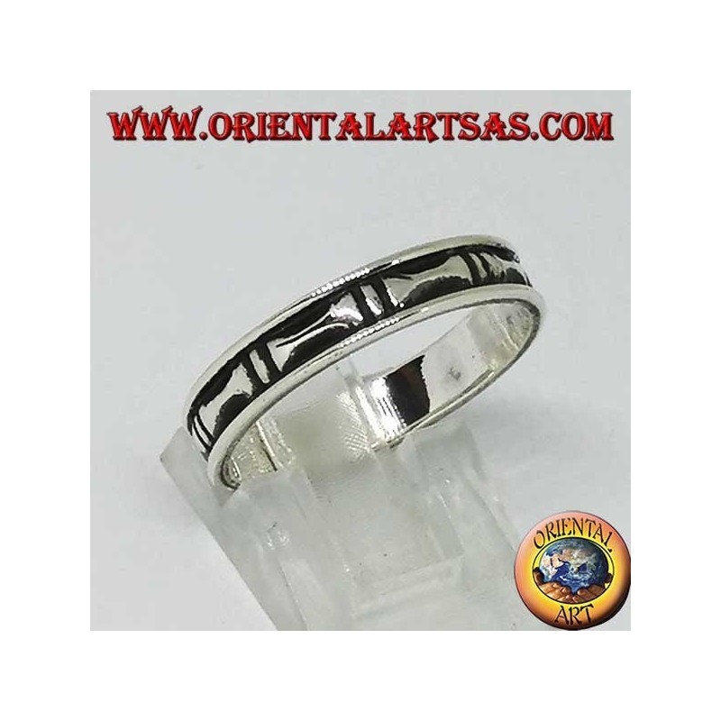Silver band ring with hollow bas-relief bones