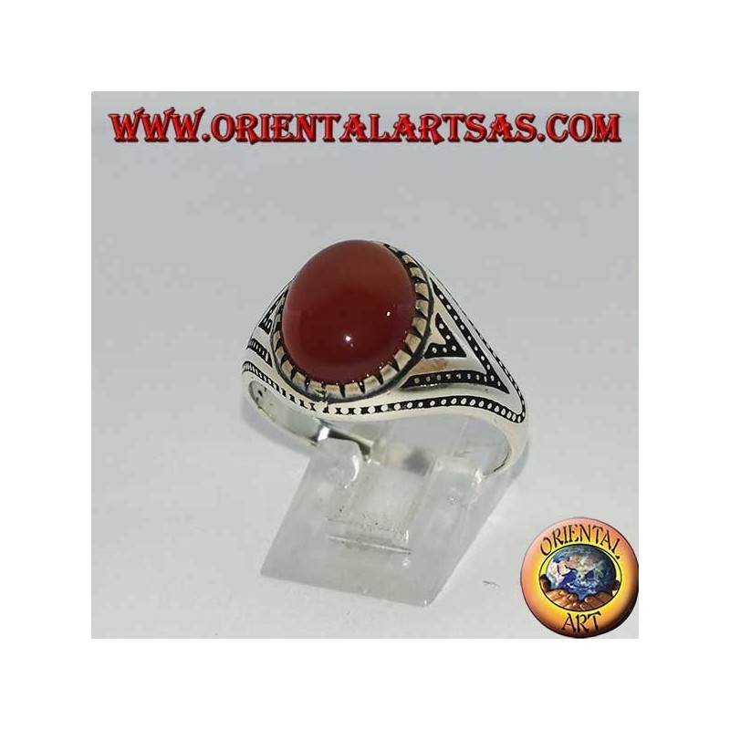 Silver ring with oval carnelian set with triangles and lateral dot decorations