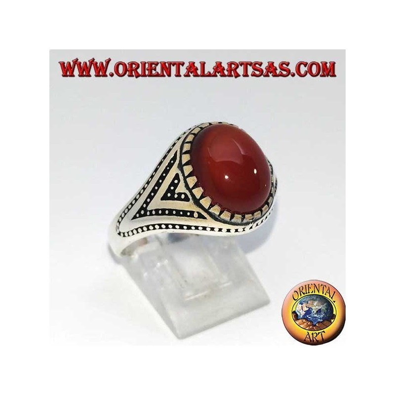 Silver ring with oval carnelian set with triangles and lateral dot decorations