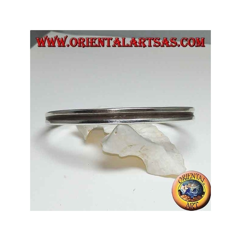 Rigid silver bracelet with a hollowed line in the center