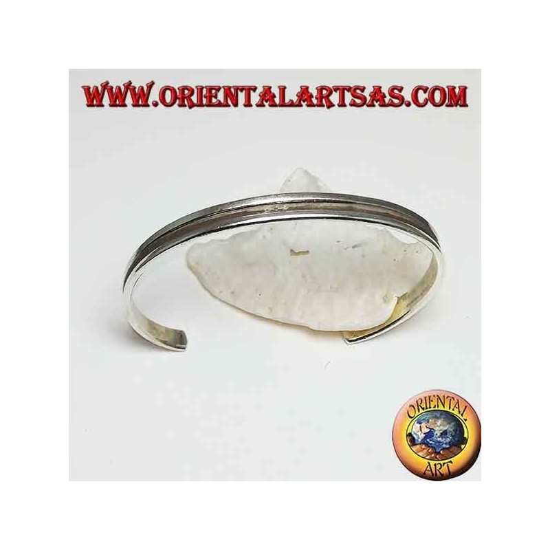 Rigid silver bracelet with a hollowed line in the center