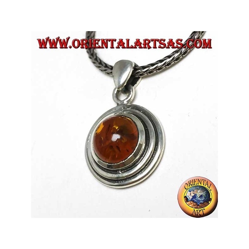 Silver pendant with a round amber, and two-wax edge
