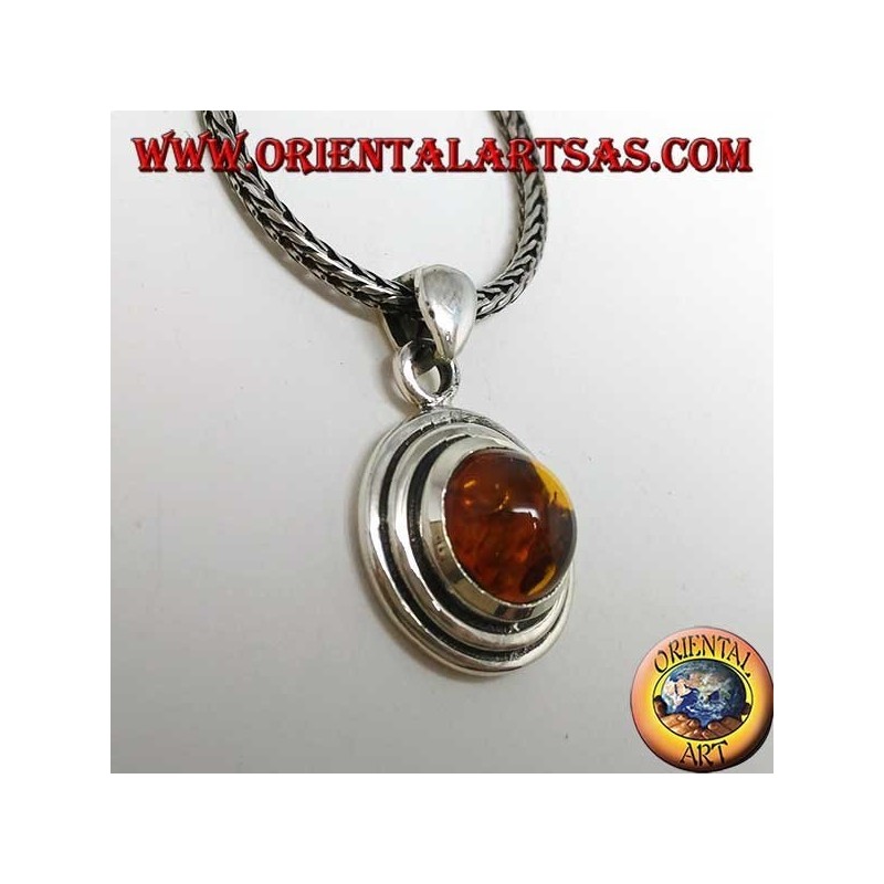 Silver pendant with a round amber, and two-wax edge