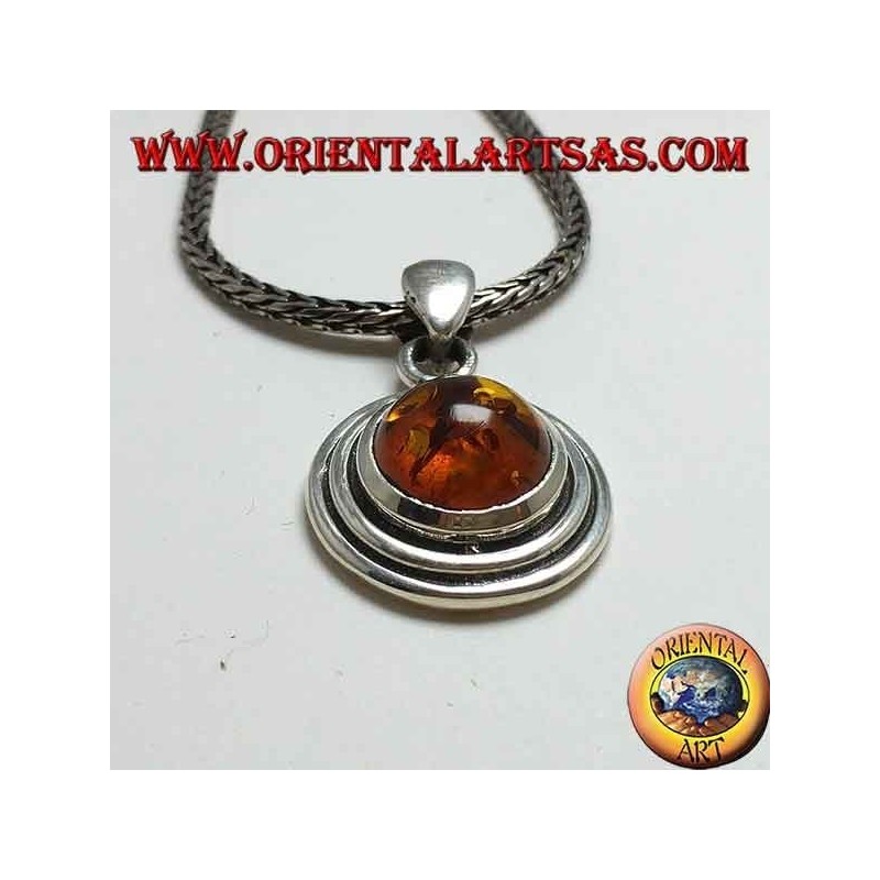Silver pendant with a round amber, and two-wax edge