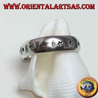 Silver band ring with alternating engraved stars and staves