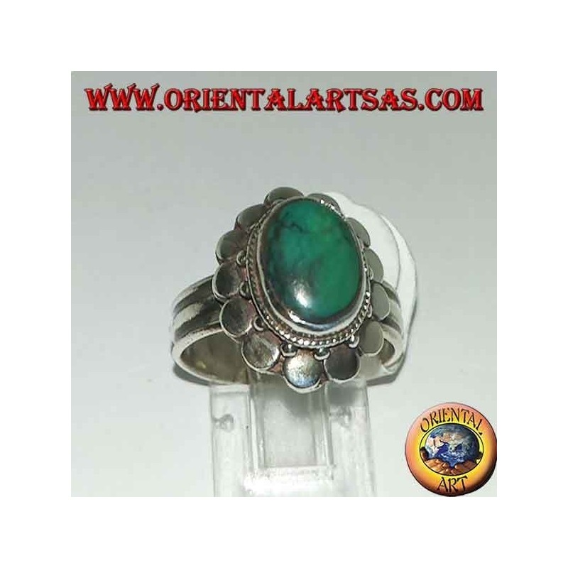 Silver ring with natural antique oval turquoise, edged with round plates