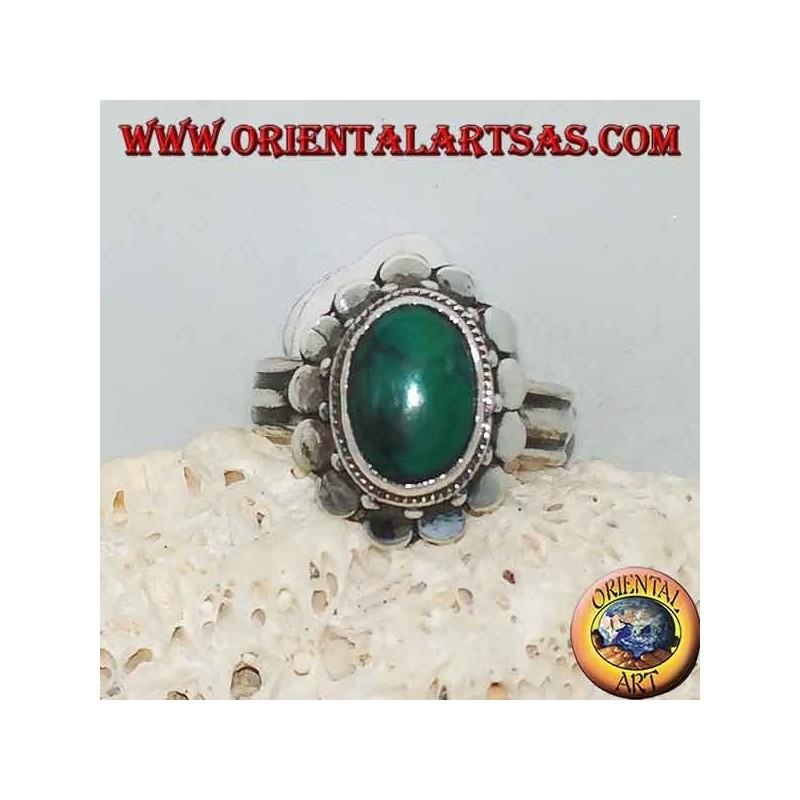 Silver ring with natural antique oval turquoise, edged with round plates