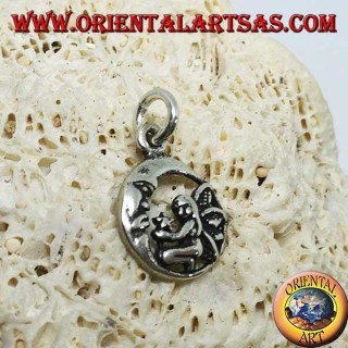 Silver fairy on her knees pendant that gives the star to the moon
