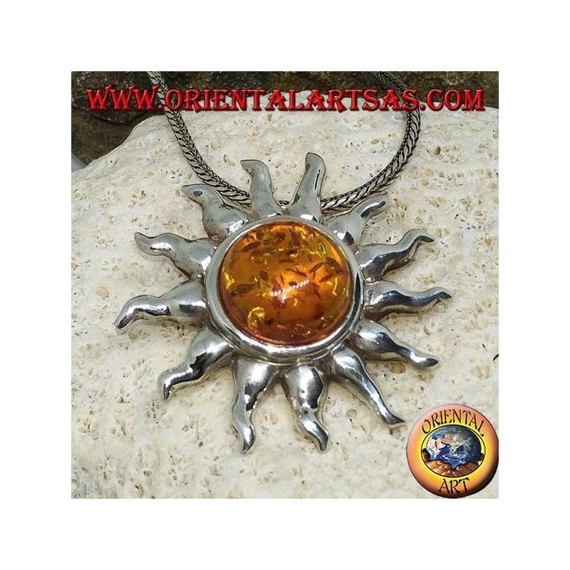 Pendant in silver sun with rays and hemispherical Amber in the center