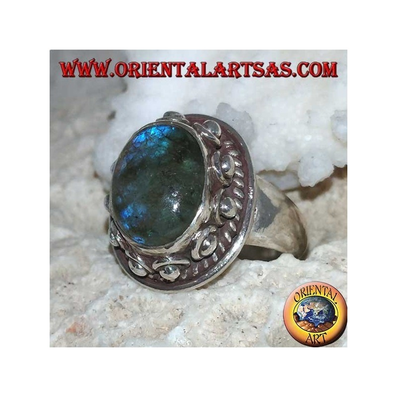 Silver ring with oval labradorite with blue reflections and studded setting