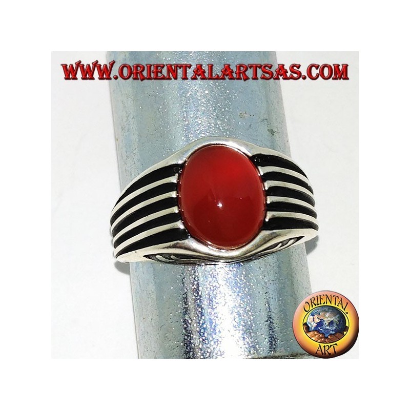 Silver ring with an oval cabochon carnelian and staves on the sides