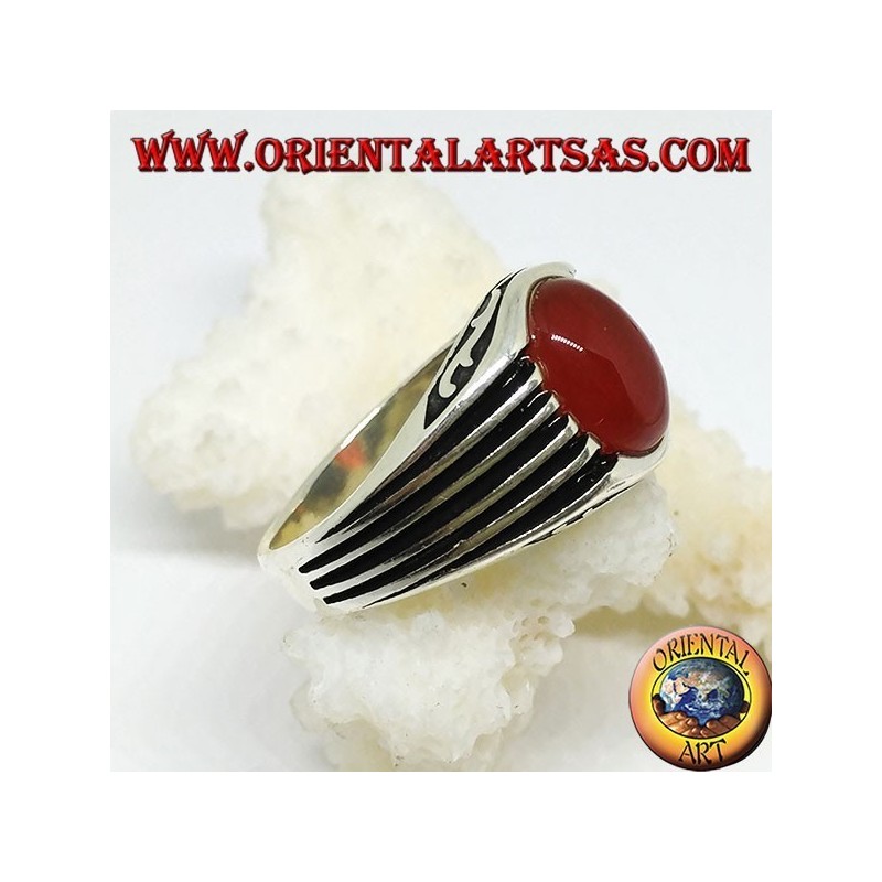 Silver ring with an oval cabochon carnelian and staves on the sides