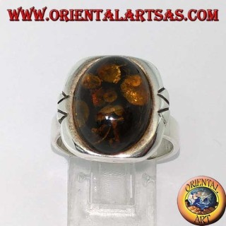 Silver ring with oval green amber and large engraved border