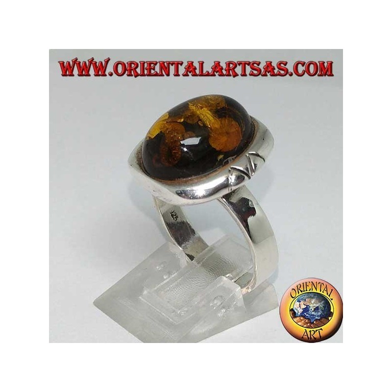 Silver ring with oval green amber and large engraved border