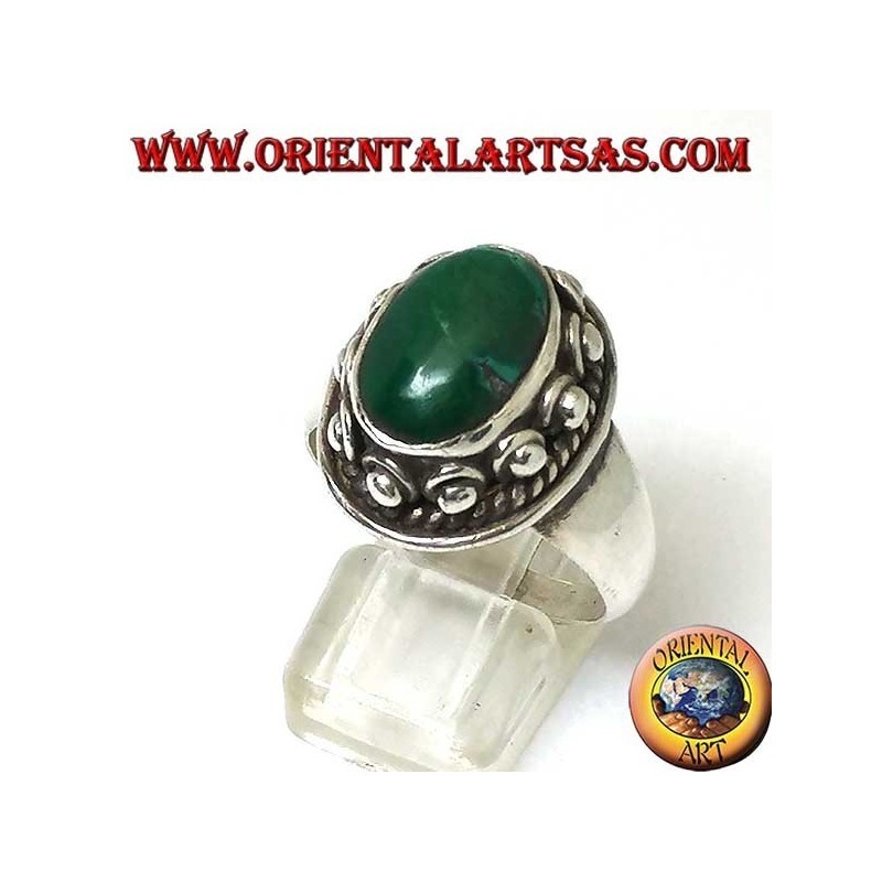 Silver ring with studs around the body, of the oval natural antique Turquoise