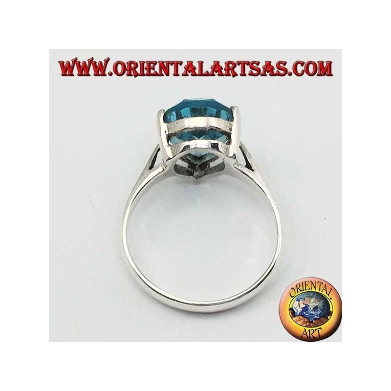 Silver ring with drop-shaped blue topaz with claw setting