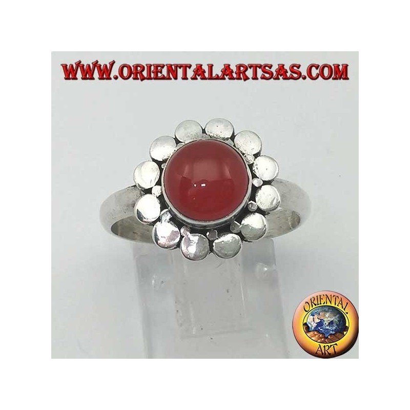 Silver ring with a round cabochon carnelian surrounded by studs