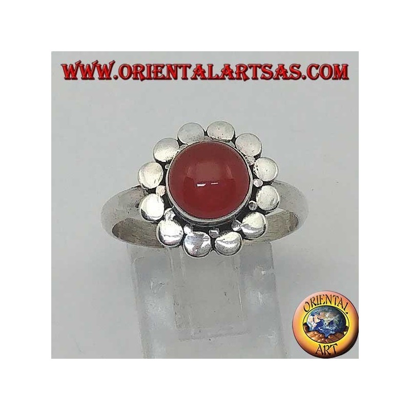 Silver ring with a round cabochon carnelian surrounded by studs