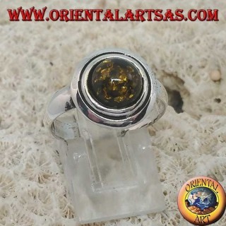 Silver ring with green round amber embraced by discs