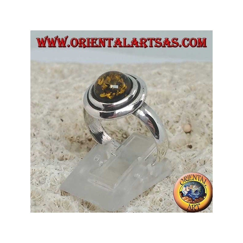 Bague en argent avec ambre rond vert entouré de disques