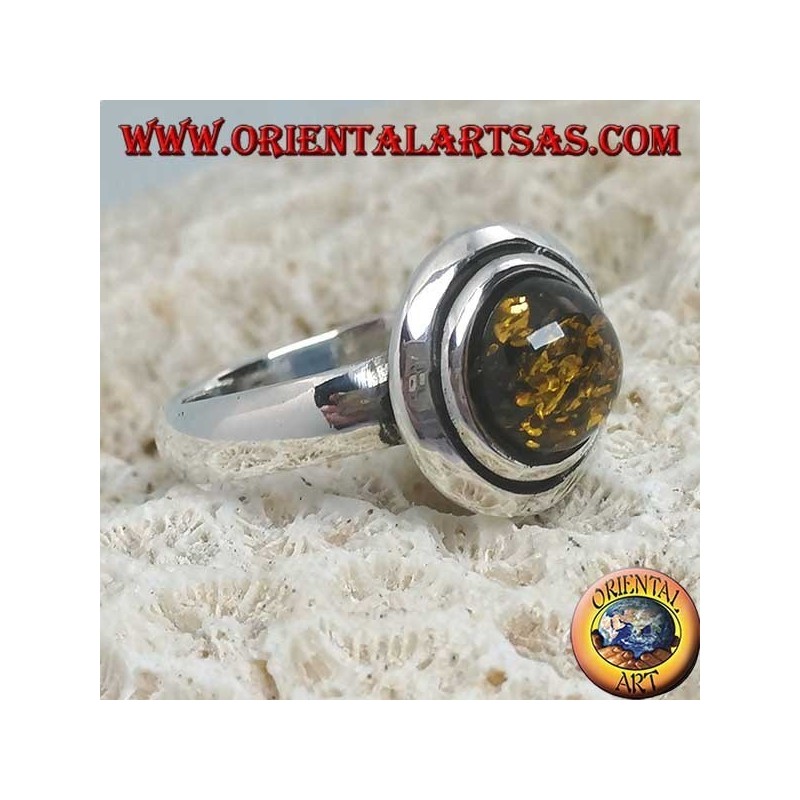 Silver ring with green round amber embraced by discs