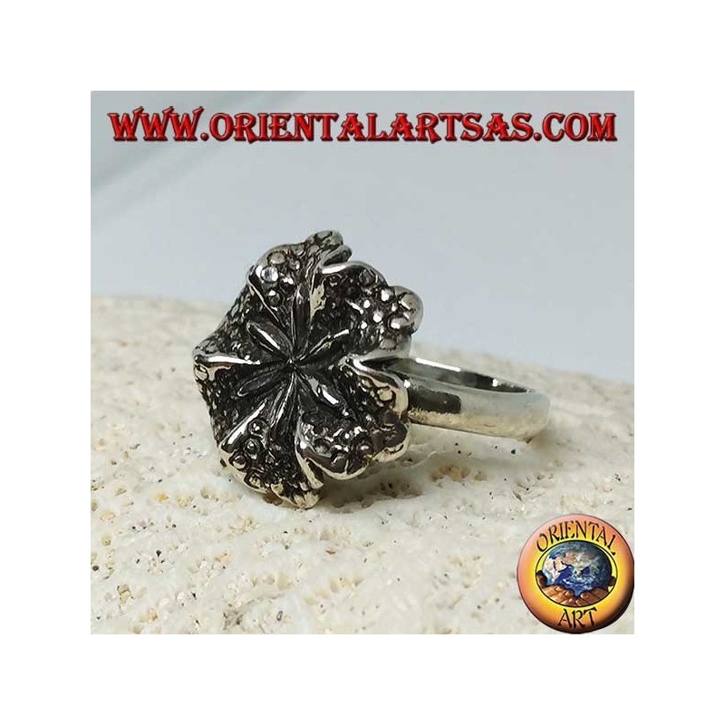 Silver ring in the shape of a lily flower, a symbol of purity