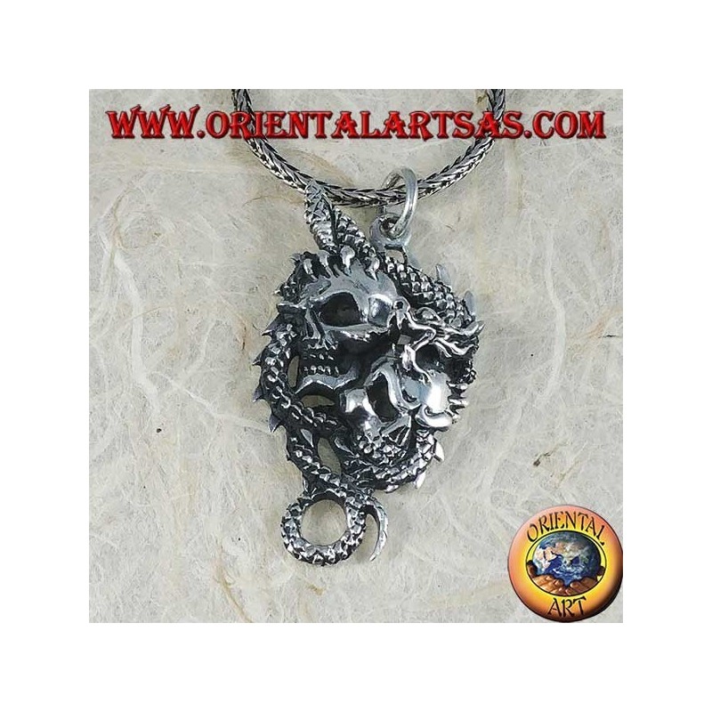 Pendentif dragon en argent avec deux crânes
