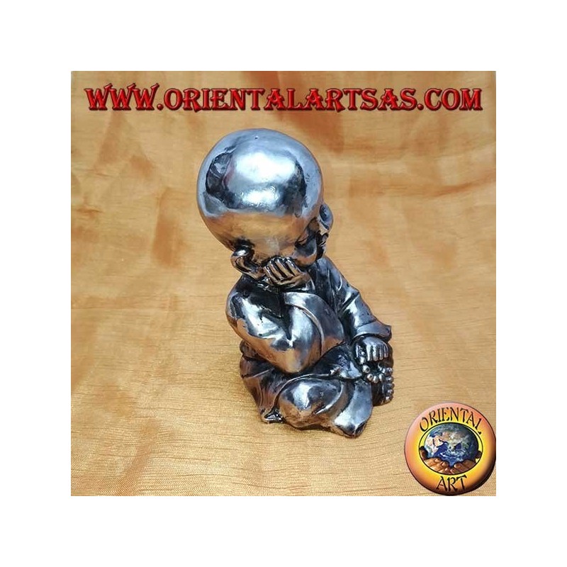 Buddhist pupil in thought (small) in resin