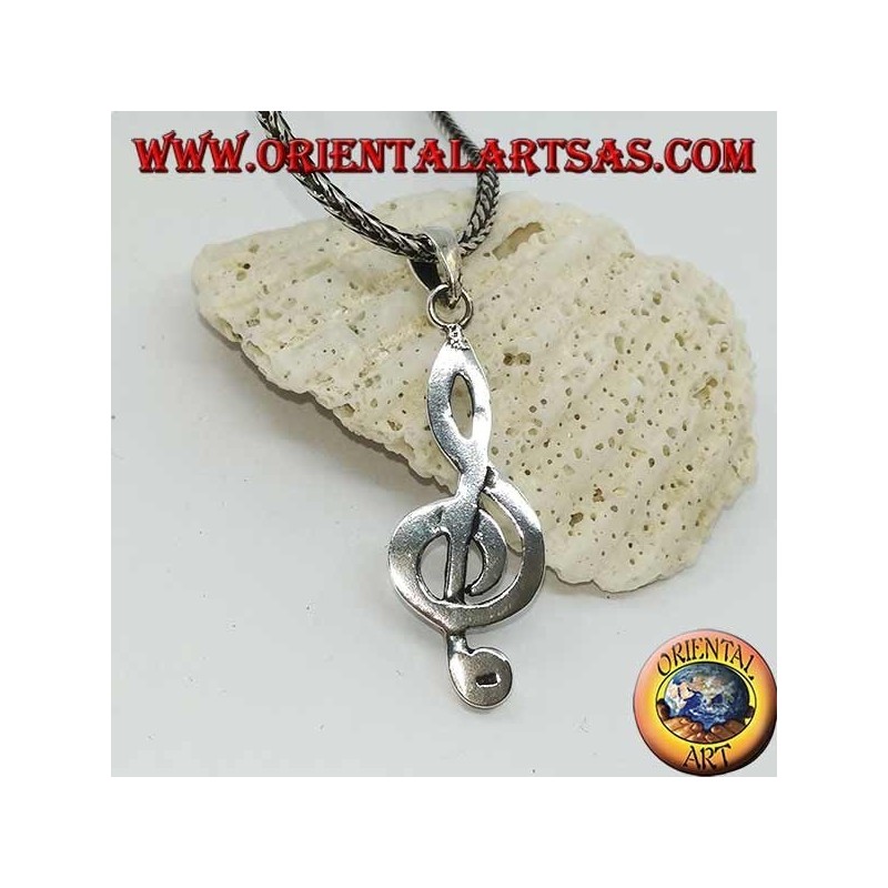 silver pendant treble clef or key of a large sun
